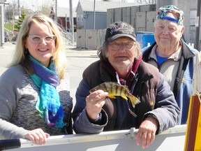 Contributed Photo
Dennis Rocheleau, centre, is pictured with Port Dover Perch Derby volunteer Regan Karges and headquarters chair Bill Jaques. Last week, Rocheleau reeled in a purple tag fish valued at $1,000 during the derby.