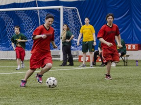 Loyalist Lancers' Kelsey Hart chases after Queen Elizabeth Raiders' Brittney Kehoe for the ball. The Special Olympic - 4 Corners Youth Sport Competition regional soccer qualifier was held in the soccer dome at the Kingston Military Community Sports Centre on Monday.