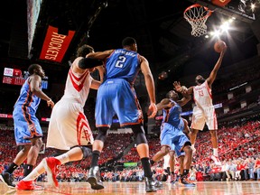 James Harden #13 of the Houston Rockets shoots a layup against Kendrick Perkins #5 of the Oklahoma City Thunder in Game Four of the Western Conference Quarterfinals during the 2013 NBA Playoffs on April 29, 2013 at the Toyota Center in Houston, Texas. (Layne Murdoch/NBAE via Getty Images/AFP)