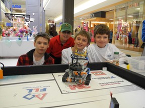 Joshua Pegg, Douglas Robinson, Matthew Bill and Liam Ault — members of the Maxville First Lego League team — showed off their robot  and course at the Cornwall Square on the weekend.
Staff photo/KATHRYN BURNHAM