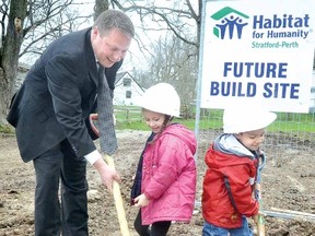 Stratford Mayor Dan Mathieson joins Bianca, 5, and Brayden Lara, 3, at a groundbreaking ceremony for the newest Habitat for Humanity Stratford-Perth building site on Railway Ave. (SCOTT WISHART Staff photographer)