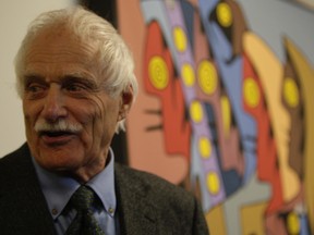 Alan Gordon speaks to the media during the unveiling of a painting at Algoma University recently. Gordon a former board member to the school donated a painting, Four Women Hand Drummers, by artist John Laford to be hung in the Essar Convergence Centre on the Universities Campus.