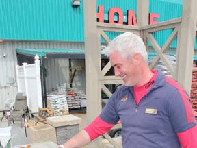 Garden centre manager Stephen Duesener cooks some hot dogs during the Nipawin coop trade show.