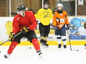 Master skater Dan Selin puts OHL player Brett Hargrave through a drill during a demonstration of his MMSP.ca (muscle memory skill patterns) program unveiled at Memorial Gardens, Monday.