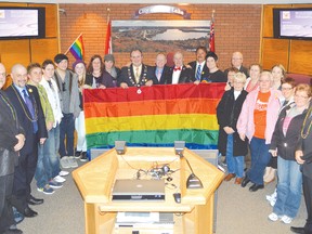 Elliot Lake council, along with some local LGBT community and its supporters, hold up the Rainbow Flag in council chambers.