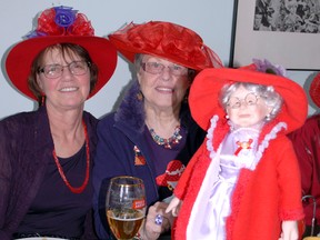 RICK OWEN • Northern News
Red Hat members Carmelle Rheaume, from New Liskeard and Barbara Makarchuk, from Kirkland Lake, were proud to show their true colours as they enjoyed fellowship and a  meal at the annual luncheon held at the Kenogami Bridge Inn.