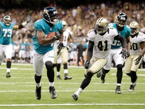 Jacksonville Jaguars wide receiver Justin Blackmon (2nd L) scores a touchdown against the New Orleans Saints during their pre-season NFL football game at the Mercedes-Benz Superdome in New Orleans, Louisiana, August 17, 2012. (REUTERS)