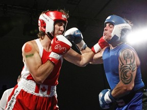 Liberal Member of Parliament Justin Trudeau and Conservative Senator Patrick Brazeau fight during their charity boxing match in Ottawa March 31, 2012. (Chris Wattie/REUTERS)