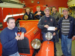 SARAH DOKTOR Times-Reformer
Committee members from the Wanda and Scott Salverda Memorial Golf Tournament presented a $5,000 donation to the Hagersville Firefighters' Association, which will be used toward the purchase of an off road vehicle to fight brush fires. From left to right are captain Jason Gallagher, committee member Chris Streutker, committee member John Miedema, committee member Steve Boekee, captain Cary Slote and secretary and treasurer of the golf tournament Jack Ouwendyk.