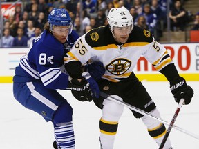 Leafs' Mikhail Grabovski battles with Bruins' Johnny Boychuk Saturday, February 2, 2013, at the ACC. (Craig Robertson/Toronto Sun)