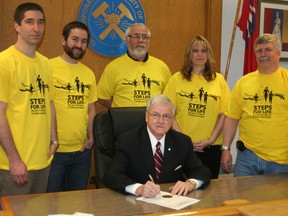 The City of Timmins helped kick off the week leading up to this Sunday’s Steps for Life walk at Gillies Lake by proclaiming Sunday, May 5 as Steps for Life Day. Coun. Mike Doody, seated, provided the honours as acting mayor while representatives of the Timmins chapter of Steps for Life attended in support. Standing from left are Gilbert Racine, Jean-Francois Durocher, Scotty Robertson, Sue Howson and Al Armstrong.