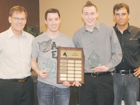 Logan Clow/R-G
The Boston Pizza Peace River Midget AA Royals held their year-end awards banquet at the Sawridge Inn on Saturday April 27, 2013. Pictured: Nathan Pickett (second from left) and Drayton Brennan (second from right) receive the team’s Top Forward award from Head Coach Mike Tookey (left) and Assistant Coach Charlie Robert (right). Pickett had 11 goals and 22 assists during the regular season and Brennan had 17 goals and 18 assists. The Royals finished second in the Northern Alberta Midget AA Hockey League with a 23-8-1 record. See Page 19 for the full story.