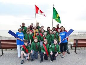 The Port Elgin Scout Troop and friends gathered at the Southampton Flagpole on Tuesday, for the ceremonial handing over of the paddle as Delores Sullivan stepped down as chair executive of Put in and Paddle. The Martha and Eric Tiisler will be assuming responsibility of maintaining the fundraiser that is to be held August 10 to help raise funds to support the Saugeen Memorial Hospital and towards youth programs, which includes the Sunset Area Scout Paddling program and more. Pictured are the Port Elgin Scout Troops officially accepting the  paddles from Delores Sullivan and Melanie Myers, director of the Saugeen Memorial Hospital Foundation.