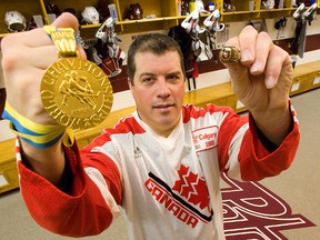 Peterborough Petes' interim head coach Jody Hull with his Team Canada jersey, gold medal and ring from the 1988 World Junior Hockey Championships in Russia. CLIFFORD SKARSTEDT/QMI AGENCY