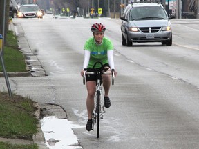 Christeena Nienhuis rides her bike up Murphy Road, in Sarnia Ont. Monday April 29, 2013. The 23-year-old is organizing a Ride the Roads cycling event May 18 to promote safe riding on city streets. She's also participating in a cross-continent ride and fundraiser for poverty reduction initiatives this summer. TYLER KULA/ THE OBSERVER/ QMI AGENCY