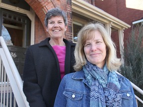 Hospice Kingston's Barb Thompson, left, and Sandra Whaley in front of the organization's offices on Barrie Street. (Michael Lea The Whig-Standard)