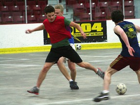 Members of the St. Thomas Aquinas boys soccer team practice indoors at the Kenora Recreation Centre. Both high school teams in Kenora are waiting for the fields to dry before their seasons start on Wednesday, May 8.
GRACE PROTOPAPAS/DAILY MINER AND NEWS