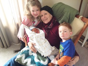 Louise Cowan, pictured with her grand-children, said the Canadian Cancer Society’s work in advocating for cancer patients has been a great benefit to her. (Submitted Photo)