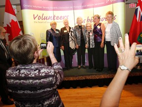 Bellevile resident Grace Grills, second from left, has received an Ontario Volunteer Service Award in Belleville Wednesday evening in recognition of her 60 years of service with Belleville General Hospital Auxiliary. In total, 143 volunteers from Belleville, Quinte West and Prince Edward and Hastings Counties have been recognized for their dedication as volunteers, during a ceremony held at Belleville Banquest Centre. JEROME LESSARD/The Intelligencer