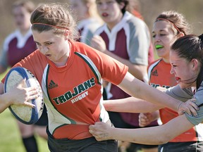 Rachel Hartley of the North Park Trojans managed to shake off the last Pauline Johnson Thunderbirds defender and run the ball more than half the length of the field to score the final try of the game, played Wednesday, May 1, 2013 at Pauline Johnson Collegiate in Brantford.
(BRIAN THOMPSON Brantford Expositor)