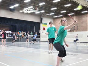 Breanne Garchinski snuck the shuttlecock over the net while partner Alex Besko looked on during mixed doubles’ play at the NESSAC badminton playoffs at TMSS on Friday, April 25.