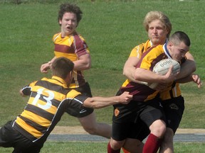 Trenton High Tigers' Matt Lalonde wraps up a St. Peter's Saints ball carrier during the Tigers' 36-5 exhibition win Saturday at THS.