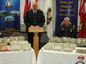 Timmins Police Chief John Gauthier, centre, speaks at a press conference held at the Timmins police station Thursday to announce a major drug bust in which four city residents were arrested. The large amount marijuana, hashish and cash seized in the bust was put on display. Those who spoke at the press conference were, from left, Timmins Police Staff Sgt. Henry Dacosta, Gauthier, Insp. Michael McGinn and Sgt. Darren Dinel.