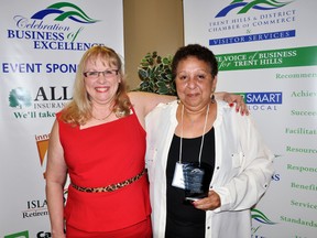 Trent Hills and District Chamber of Commerce president Schelle Holmes presents community volunteer and former Hi-Low Lodge owner and operator Camille Edwards with the President's Award Saturday night during the chamber's 2013 Celebration of Business Excellence. The chamber handed out 14 awards to local entrepreneurs.