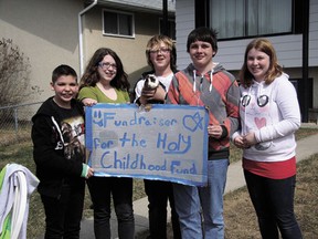 A group of Holy Spirit Catholic School students, and their mascot, ran a lemonade stand on Erie Street South over the weekend, raising over $200 for the Holy Childhood Association.
From left: Blake Falk, Rayvn Tremblay, Mitchel Nash, Kyle O’Neill and Jennifer Hart