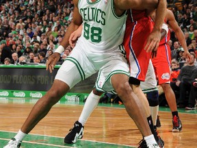 Jason Collins (No. 98) then of the Boston Celtics blocks out Los Angeles Clippers forward Blake Griffin during a Feb, 2013 game. In becoming the first active openly gay athlete in a major North American team sport Monday, Collins showed how much sports has grown and was ready for this moment. (QMI Agency file photo)