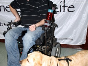 Blair Williams and his special skills dog, Nala, were on hand Thursday, to make a presentation on smart choices in Garden Village. Williams, 36, injured himself diving off a dock into shallow water in 2006 and now talks about his injury and choices as part of Parachute, a national organization dedicated to preventing injuries and saving lives.