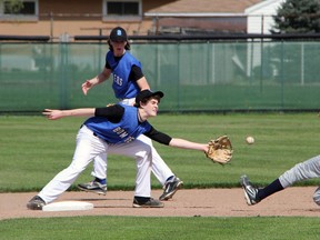Northern Viking Jesse DeBrun, right slides in to steal second base as SCITS Blue Bombers shortstop Mike Fisher reaches for the tag in LSSAA baseball action Thursday. (PAUL OWEN, The Observer)