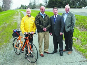 Cycling activist Alan Medcalf, St. Lawrence Parks Commission CEO Darren Dalgleish, MP Gord Brown and commission chairman Ian Wilson check out the bike path.
Wayne Lowrie/Gananoque Reporter