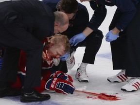 Montreal Canadiens' Lars Eller is down after being hit hard by Ottawa Senators' Eric Gryba (Martin Chevalier, QMI Agency)