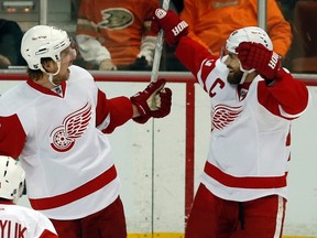 Detroit Red Wings Justin Abdelkader and Henrik Zetterberg celebrate a goal during Game 2 of their playoff series with the Anaheim Ducks in Anaheim May 2, 2013. (REUTERS/Lucy Nicholson)