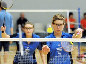 Pain Court's Emily Pepper, right, serves while partner Cassandra Faubert watches during their first match in girls doubles at the OFSAA badminton championship Thursday at St. Clair College's Thames Campus HealthPlex. (MARK MALONE/The Daily News)