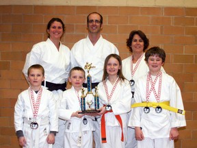 Sensei Helen Brown, back left, Sensei Dave Brown and Sensei Kathy Usik pose with students Hunter Keam, front left, Logan Waldick, Kylee Randall and Joel Hutchinson.  Absent are competitors Thomas Dubois, Liam Herring, Elli Collins and Owen Morrow. SUBMITTED PHOTO