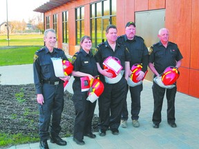 Township of Leeds and the Thousand Islands firefighters sport their new lieutenant's bars and red helmets. From left, Jack Brabazon, Robin Scott-Davis, Paul Dickson, Chris Nuttall and Ian Robertson. Absent is Jeff Murchie.      
Wayne Lowrie/Gananoque Reporter