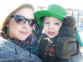 Rachelle Belanger and son Ivan, 3, gear up for the St. Patrick's Day parade in March. Ivan was grand marshal of the parade with a front seat in a fire truck. (LAURA CUDWORTH, The Beacon Herald)