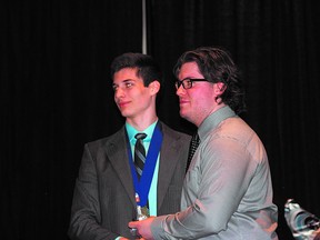 Sherwood Park Squires forward River Beattie (left) accepts the player’s choice award during the recent Kings Club end-of-the-year celebrations. Photo by Shane Jones/Sherwood Park News/QMI Agency