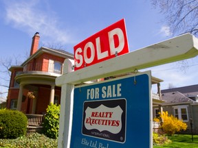 Sold signs are more common this spring as housing sales start to rebound. (MIKE HENSEN, The London Free Press)
