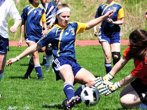 St. Mary's goalkeeper Kristin Cecchin, right, challenges St. Joseph's Ram Molly Jenkins in TVRA soccer action Friday at Alumni Field. The Rams beat their guests 2-0.  (R. MARK BUTTERWICK, St. Thomas Times-Journal)