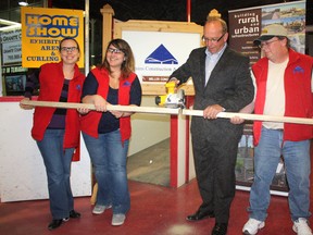 The 24th Annual Timmins Home Show kicked off on Friday at the McIntyre Arena with the traditional cutting of the 2x4 to open the show. Timmins councillor Gary Scripnick performed the cutting with a power saw, while, from left board member Veronique Harvey, event coordinator Caroline Mallette and Timmins Construction Association president Rick Racicot held the wood.