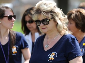 Janice McMichael-Dennis, Bluewater Power CEO, walks with a group of Bluewater Power workers and their family members in the fourth annual Steps for Life 5k Walk in Sarnia Saturday. The walk attracted about 200 walkers for the families of victims of workplace tragedy. Among those remembered was Bluewater Power lineman Mike Leach, killed last October. TYLER KULA/ THE OBSERVER/ QMI AGENCY