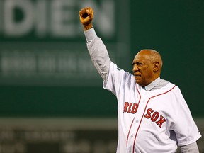 Bill Cosby gestures to the crowd at a Boston Red Sox game in September 2012.