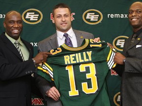 Head coach Kavis Reed (left) and general manager Ed Hervey introduce the Edmonton Eskimos' new quarterback Mike Reilly during a press conference at Commonwealth Stadium on Feb. 6. Monday's CFL Draft will be Hervey's first as the team's GM.
David Bloom/Edmonton Sun