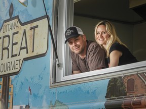 Ben Baird and partner, Elyse Pion, pose by their new food truck for his Ottawa Streat Gourmet venture Tuesday, April 30, 2013. Baird's truck is part of the new Ottawa food vendor program hitting the streets May 15, 2013. Darren Brown/Ottawa Sun/QMI Agency