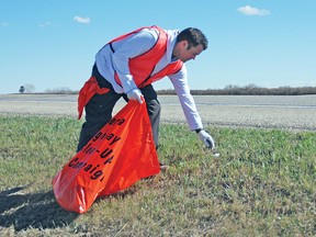 Brad Baker, a Lethbridge resident who operates the Vulcan Dental Clinic, was part of a group of about 40 people from the Lethbridge Church of Jesus Christ of Latter-Day Saints who helped clean up Highway 23 south of Vulcan all the way to Carmangay on Saturday. Alberta Transportation organizes the highway cleanup and provides materials like bags to groups that want to get involved while raising funds.