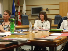 Judy Anderson, Shirley Thompson and Ingrid Galipeau view a video as part of their refresher training course for leveled literacy intervention, a program that's being run the by Grande Prairie Public School District. The three women, all retired teachers, along with three others, will be working at various schools starting Monday for an eight-week session. They'll be working with students who need an extra boost when it comes to their literacy skills. Grande Prairie, Alberta. Friday, May 3, 2013 KIRSTEN GORUK/DAILY HERALD-TRIBUNE/QMI AGENCY