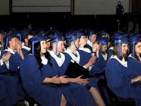 Elizabeth McSheffrey/Daily Herald-Tribune
Peace Wapiti Academy’s graduating class of 2013 applauds their student ambassador Andrea McMullan after her commencement speech at the TEC Centre in Evergreen Park on Saturday. The two-hour ceremony evoked tears, laughter and standing ovations from the school’s 112 graduates, who make up the largest class the school has ever seen.